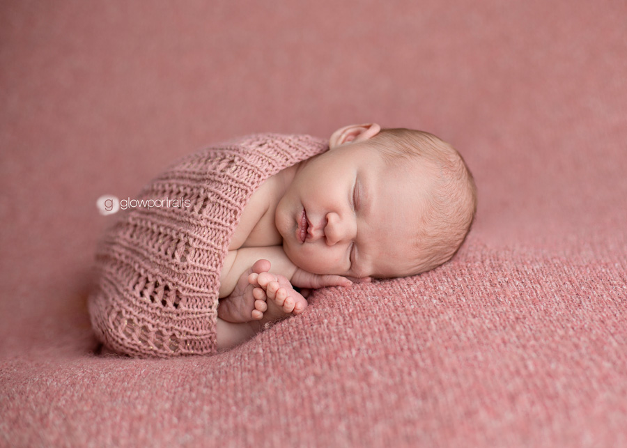 glow portraits newborn wrap on blanket