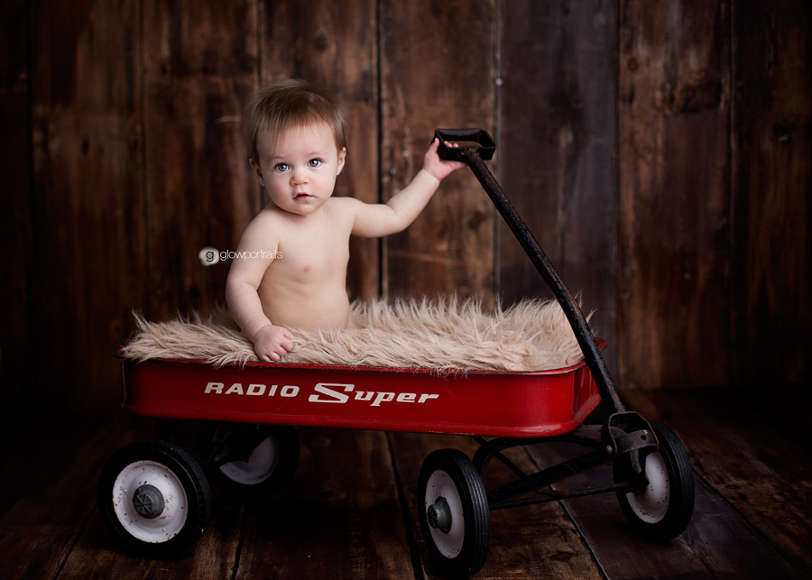 baby in red wagon