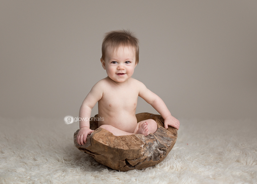 baby in wooden bowl