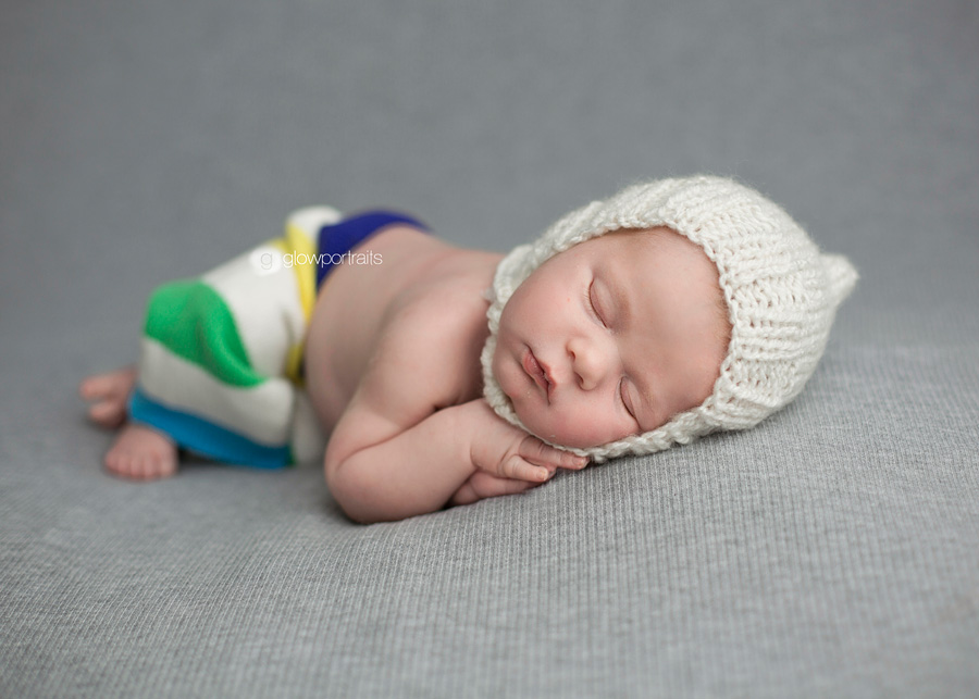 grande prairie, alberta newborn photographer newborn lying side pose on beanbag