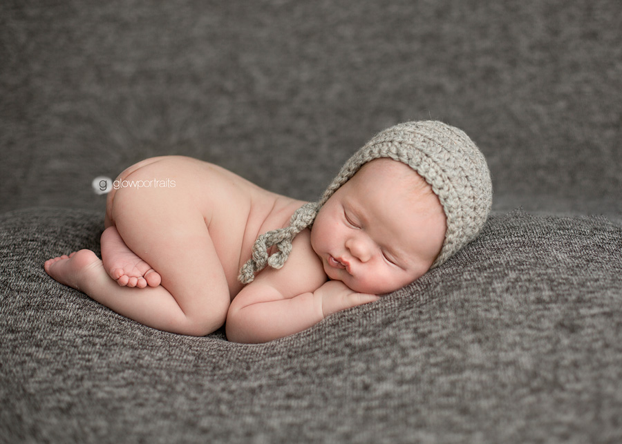 fort st john baby photographer newborn bum in air pose on beanbag