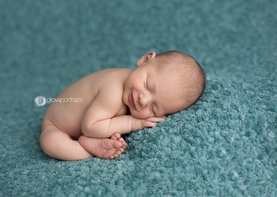 taco pose newborn smiling