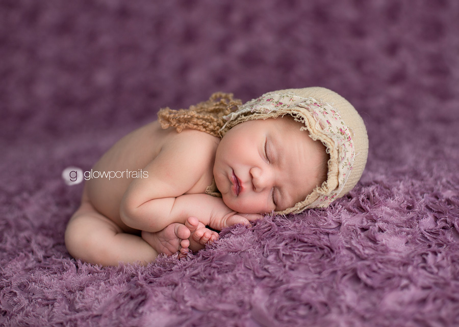 dawson creek newborn photographer newborn baby girl in taco pose on beanbag