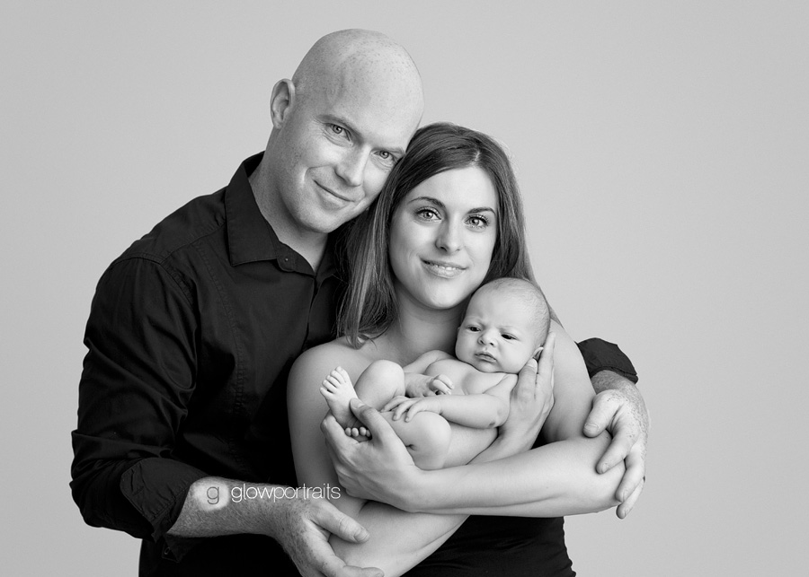 photography pose with mom dad and newborn