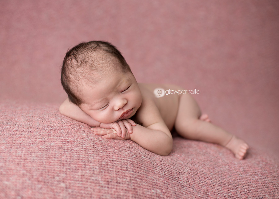bc newborn photographer chin on hands beanbag pose