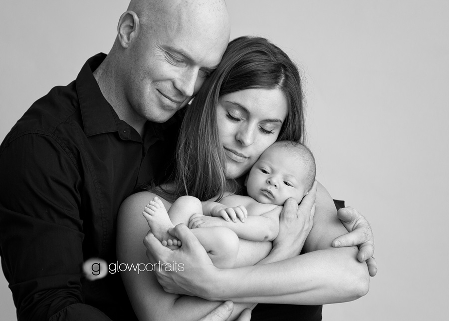 snuggling newborn baby