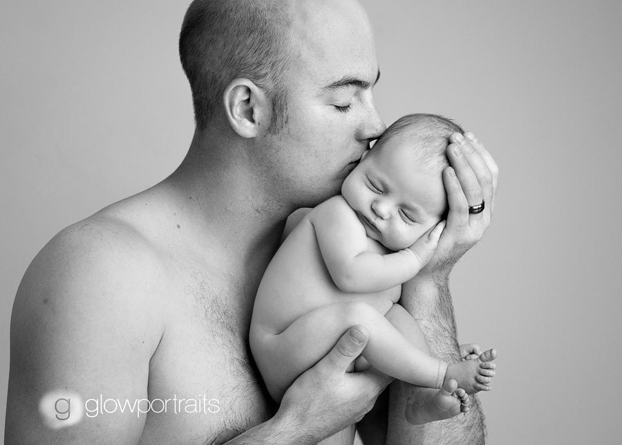 fort_st_john_bc_newborn_photographer dad and baby snuggling pose