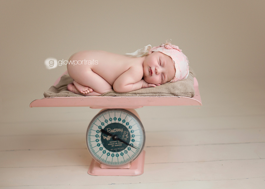 glow_portraits newborn baby on scale