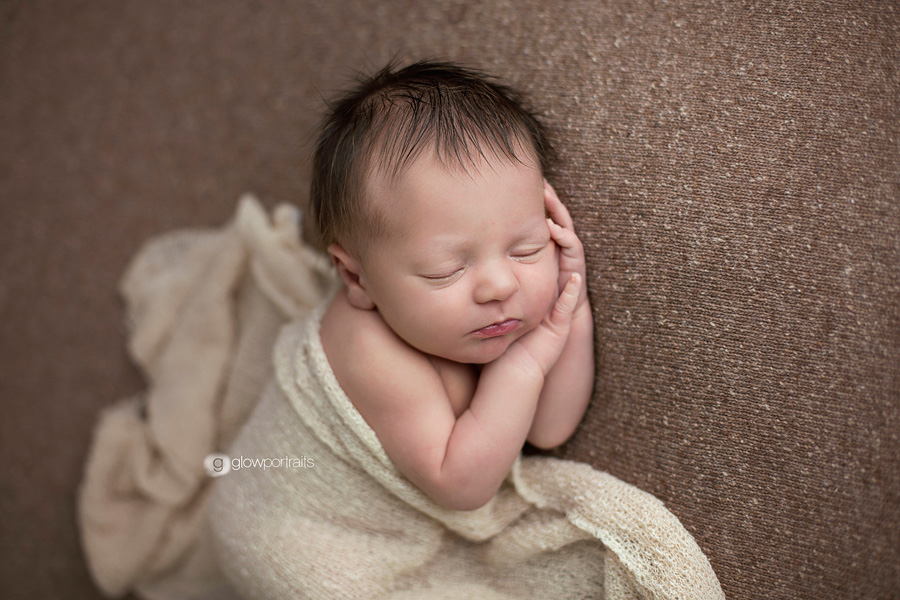 newborn on beanbag lying side pose