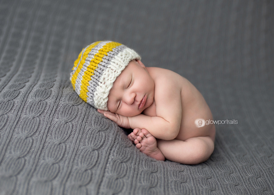 taco pose on gray blanket with hat on