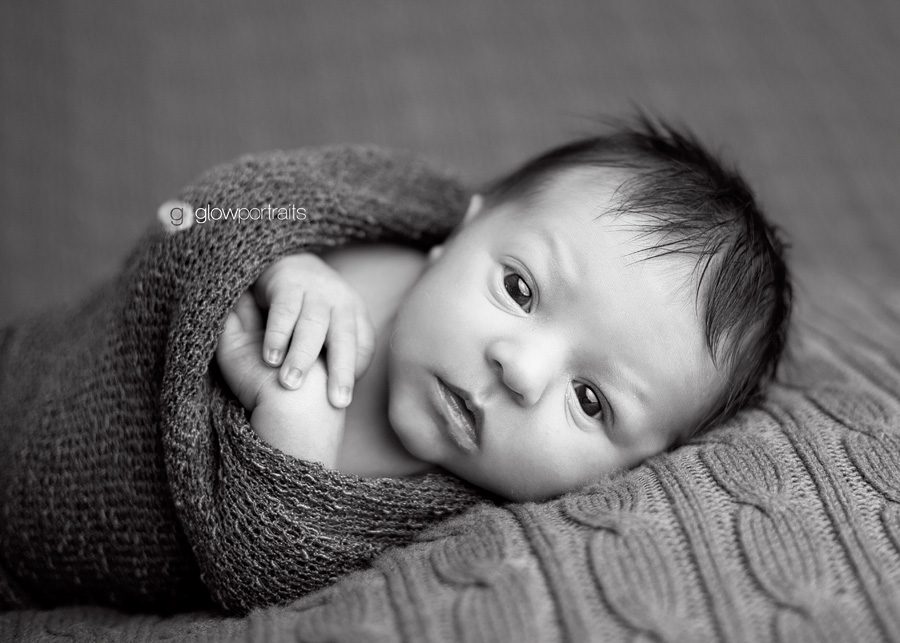 wrapped newborn with eyes open