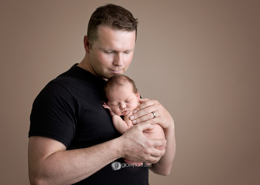 dad and newborn pose