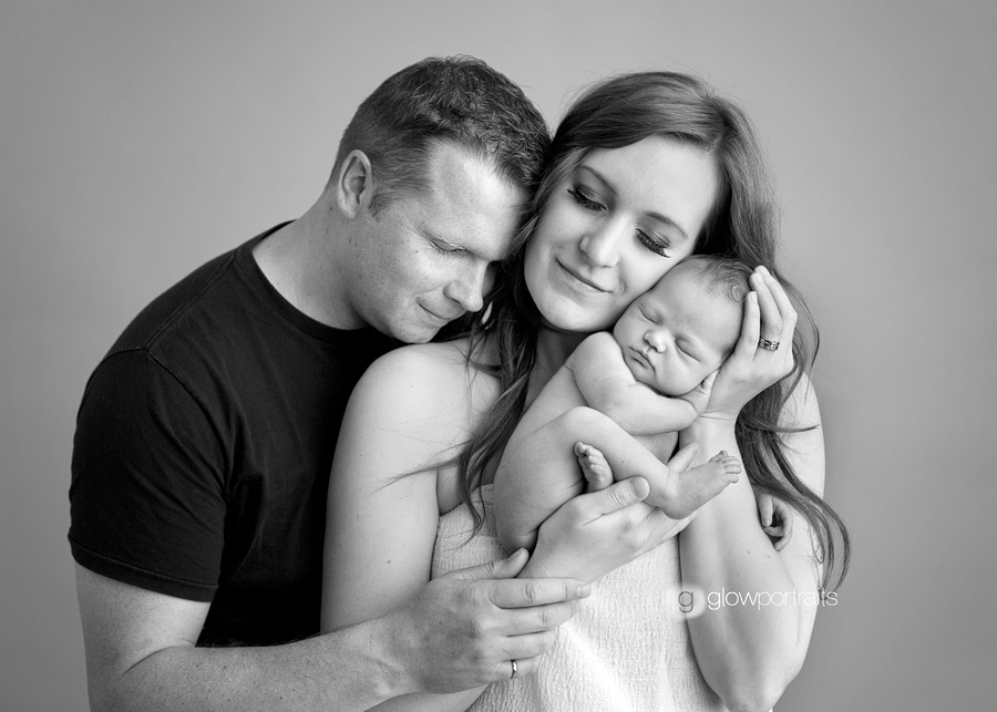 mom and dad newborn pose