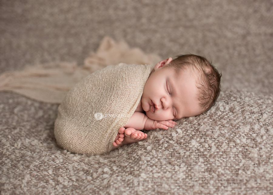 beanbag pose with newborn wrapped