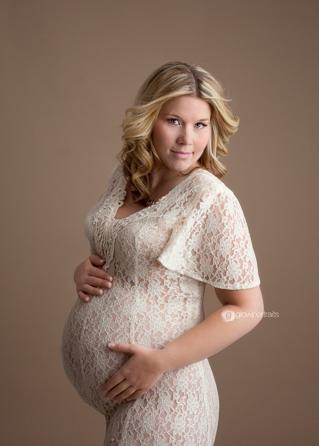cream lace dress in maternity pose