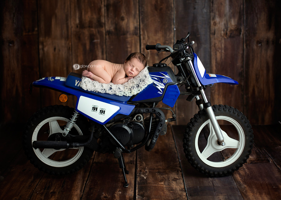 Motocross motorcycle newborn photography by Henry Roy Photography