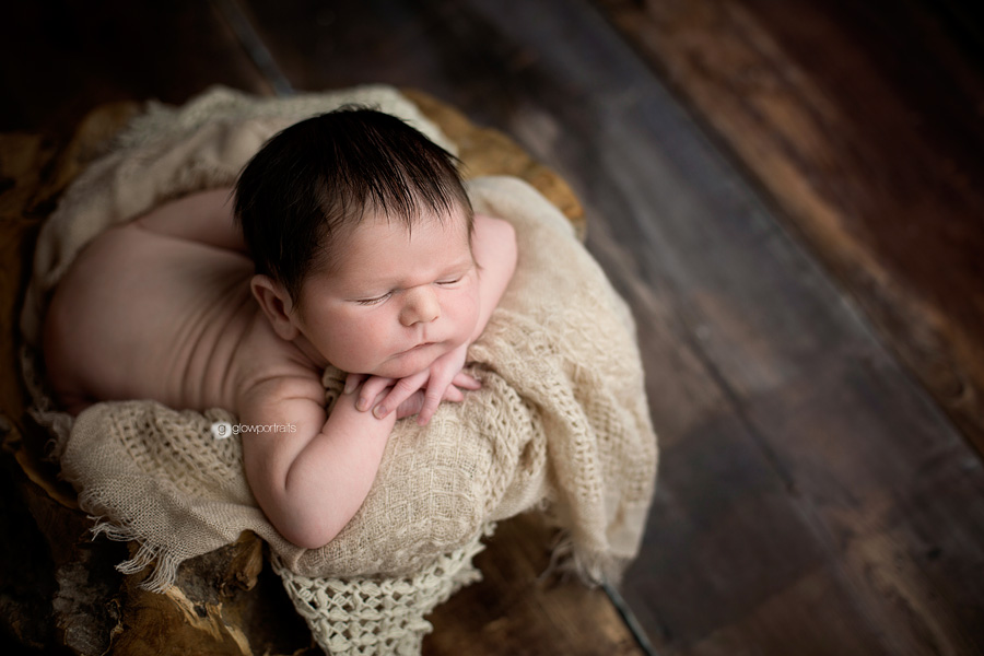 fort st. john, bc newborn photographer baby in bowl on wooden floor