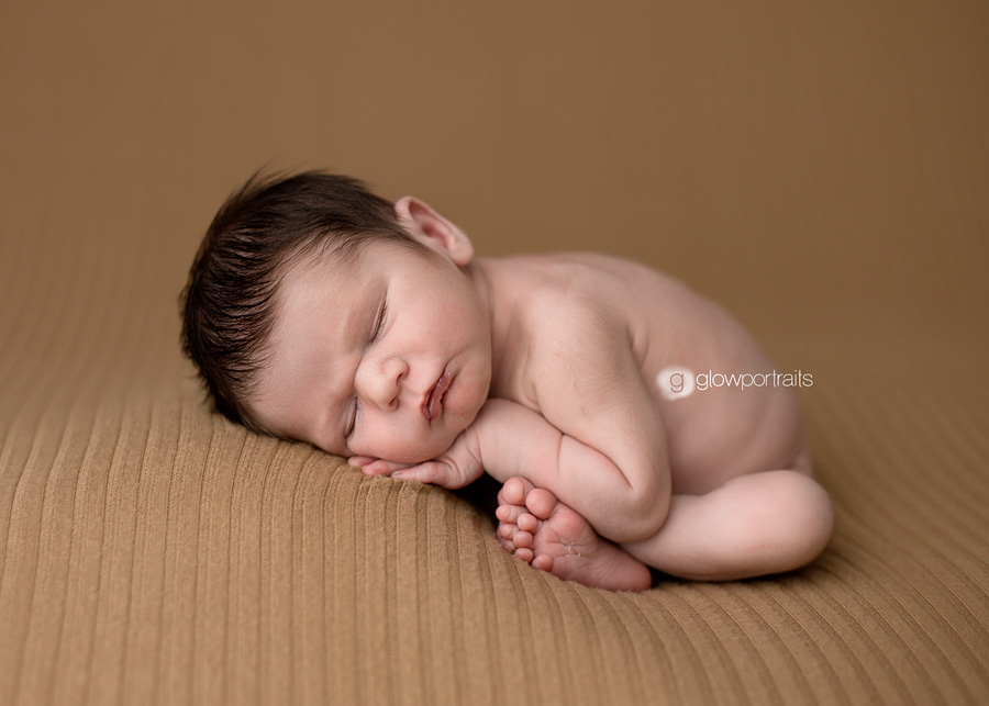 grande prairie alberta newborn photographer taco pose on beanbag