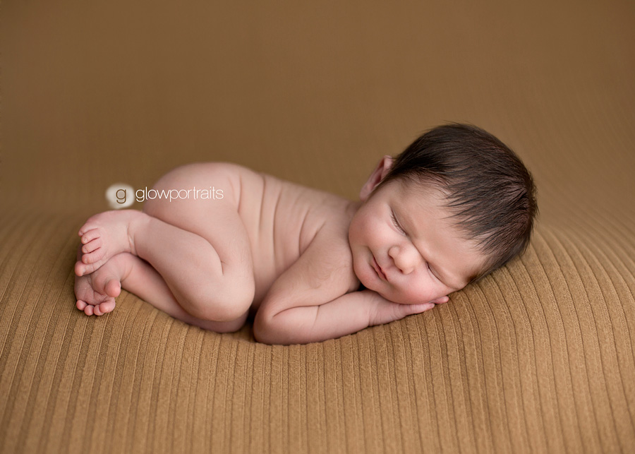 peace river newborn photographer snuggle beanbag pose