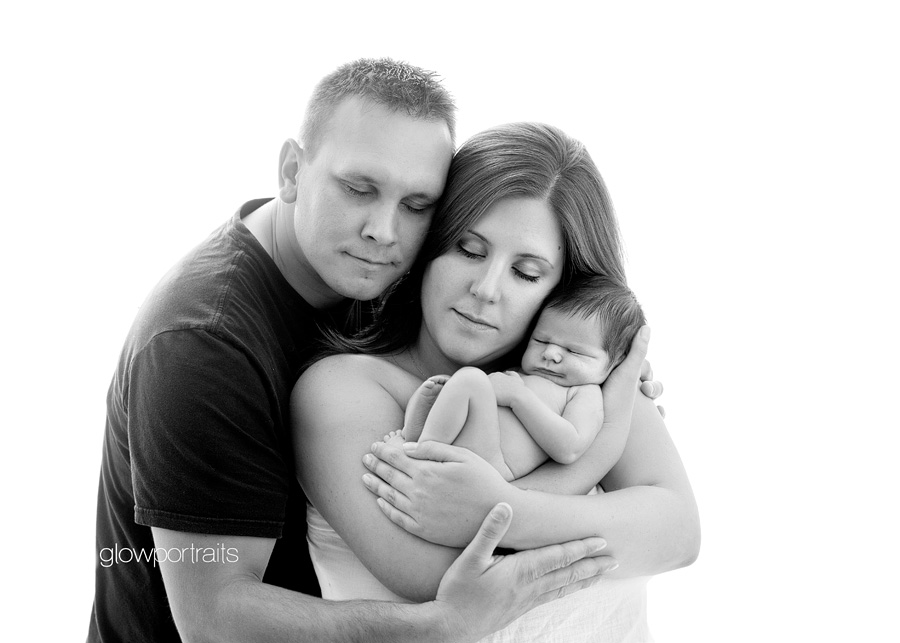 bc newborn photographer mom and dad holding newborn baby