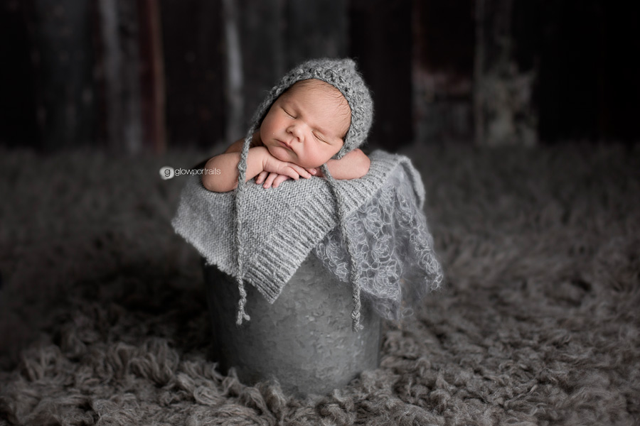 sweet baby in grays in pail