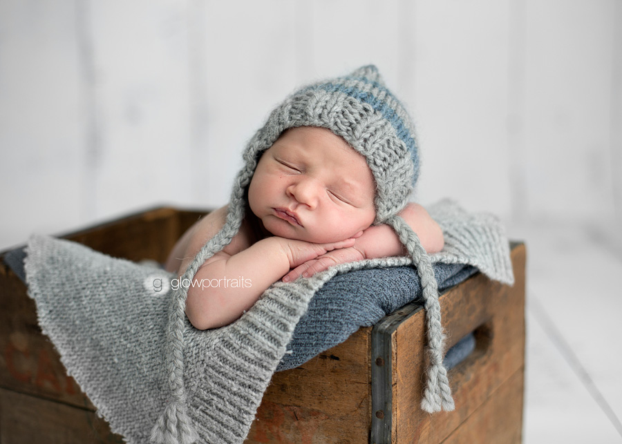 newborn in wooden box 