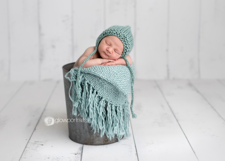 wooden backdrop baby in pail