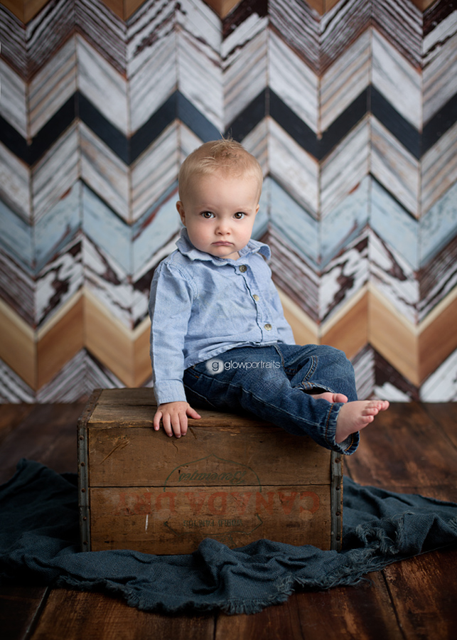 baby sitting on box chevron backdrop
