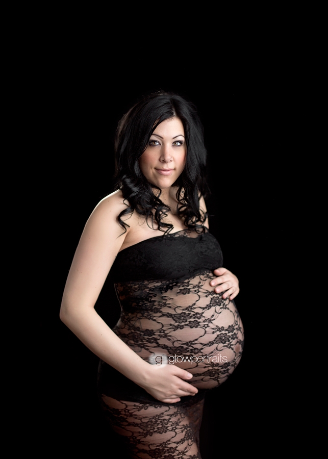 holding tummy black dress maternity