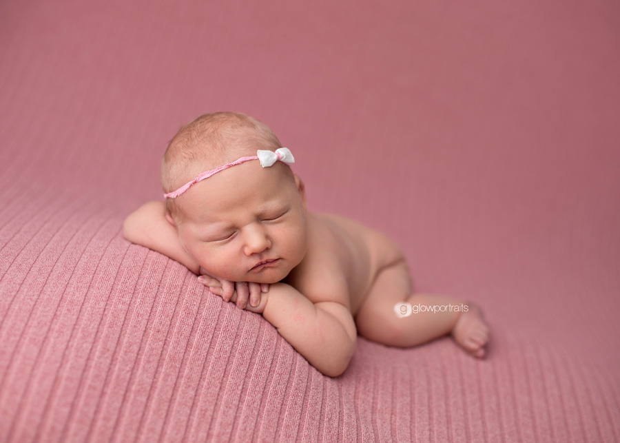 newborn baby girl on beanbag pose