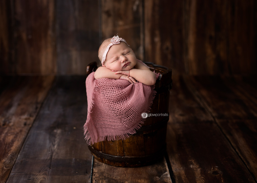 newborn in bucket