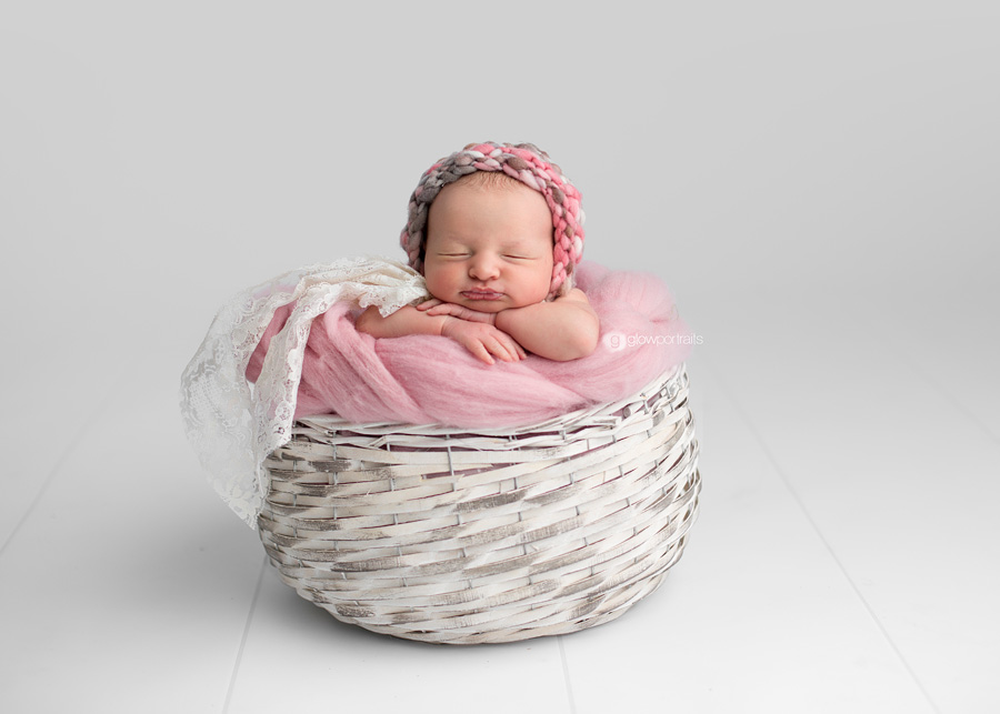 baby girl in white basket