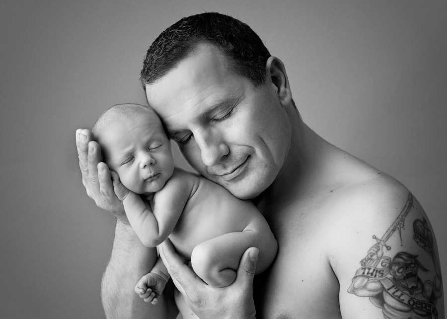 daddy holding newborn boy
