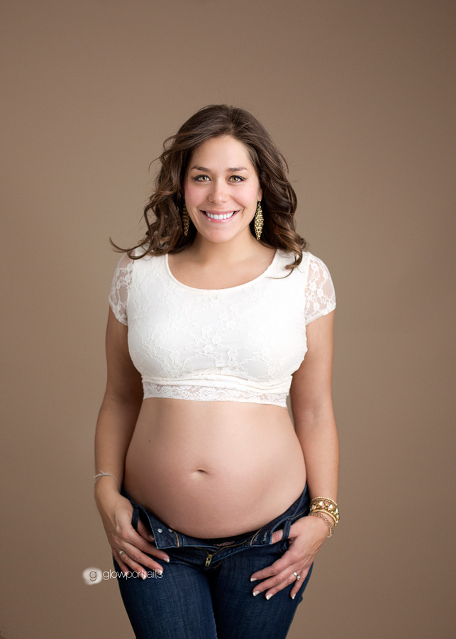 maternity pose wearing white lace top