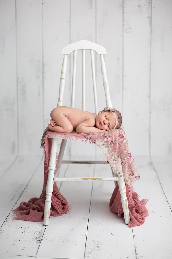 newborn on chair