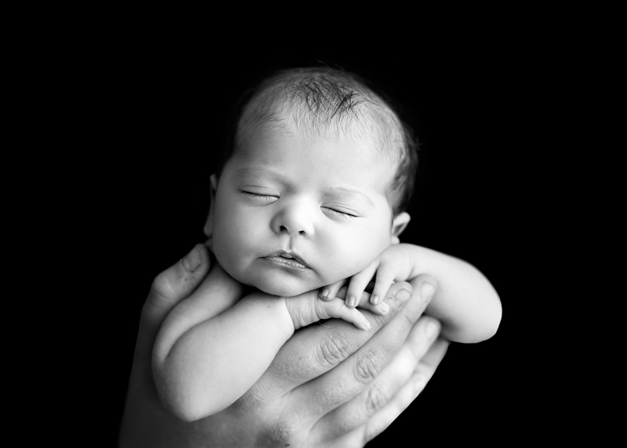 newborn in daddy's hands