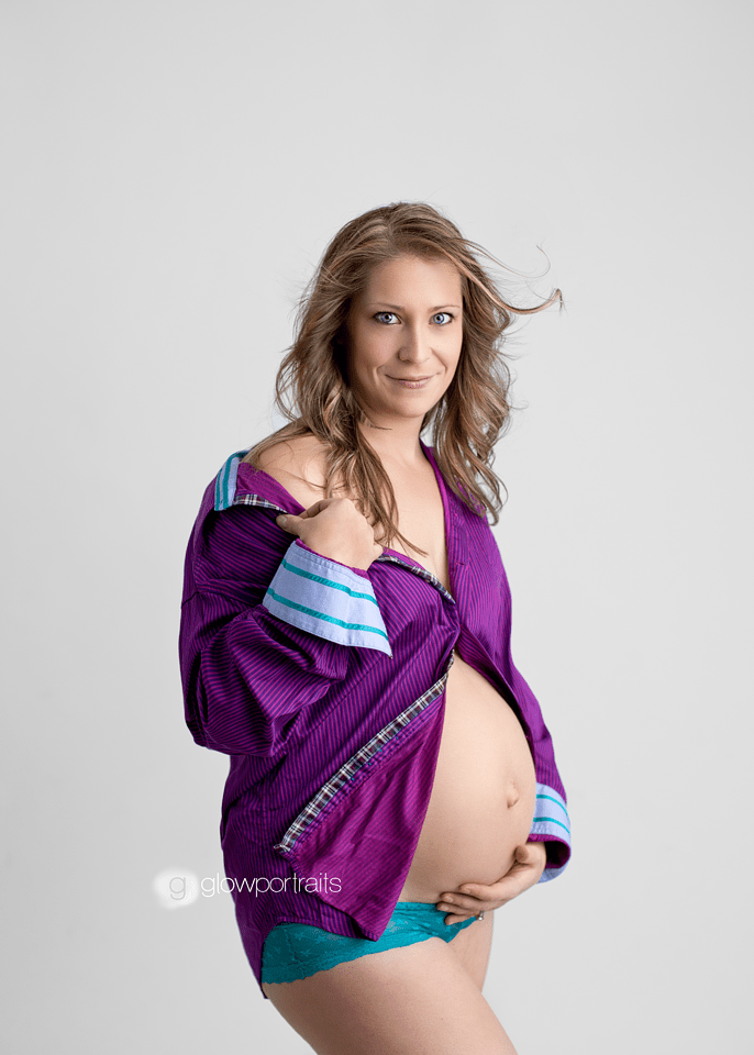 pregnant mama wearing husbands purple shirt