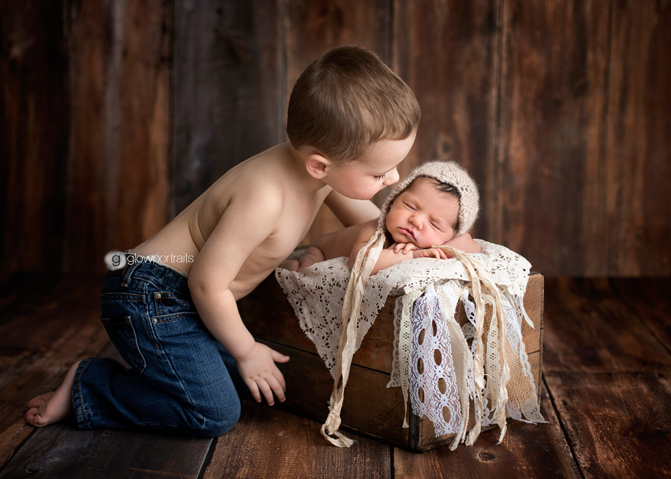 big brother kissing his baby sister