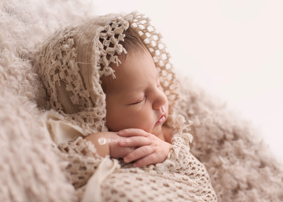 profile side lit newborn image
