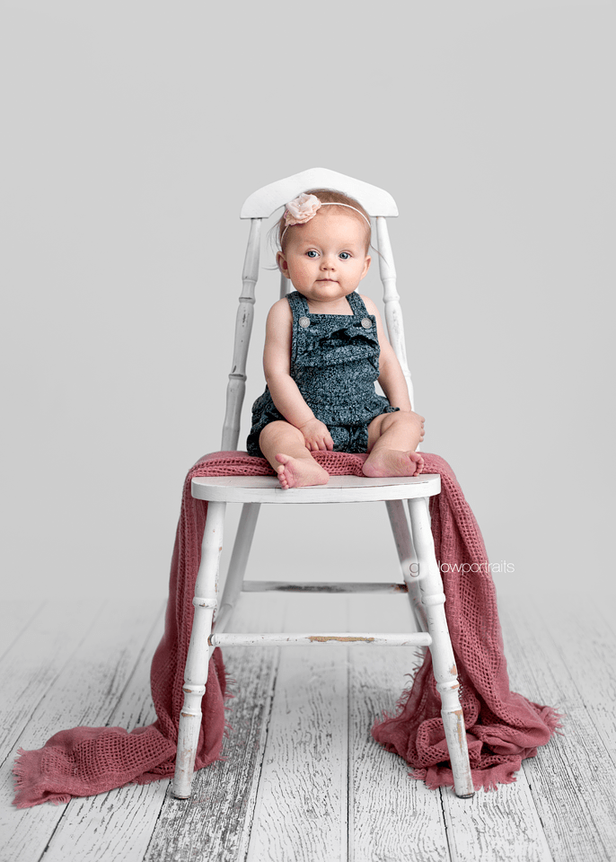 little girl sitting on chair