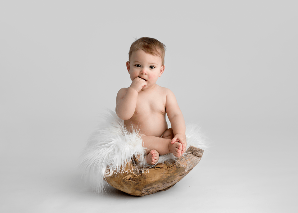 baby in wooden bowl