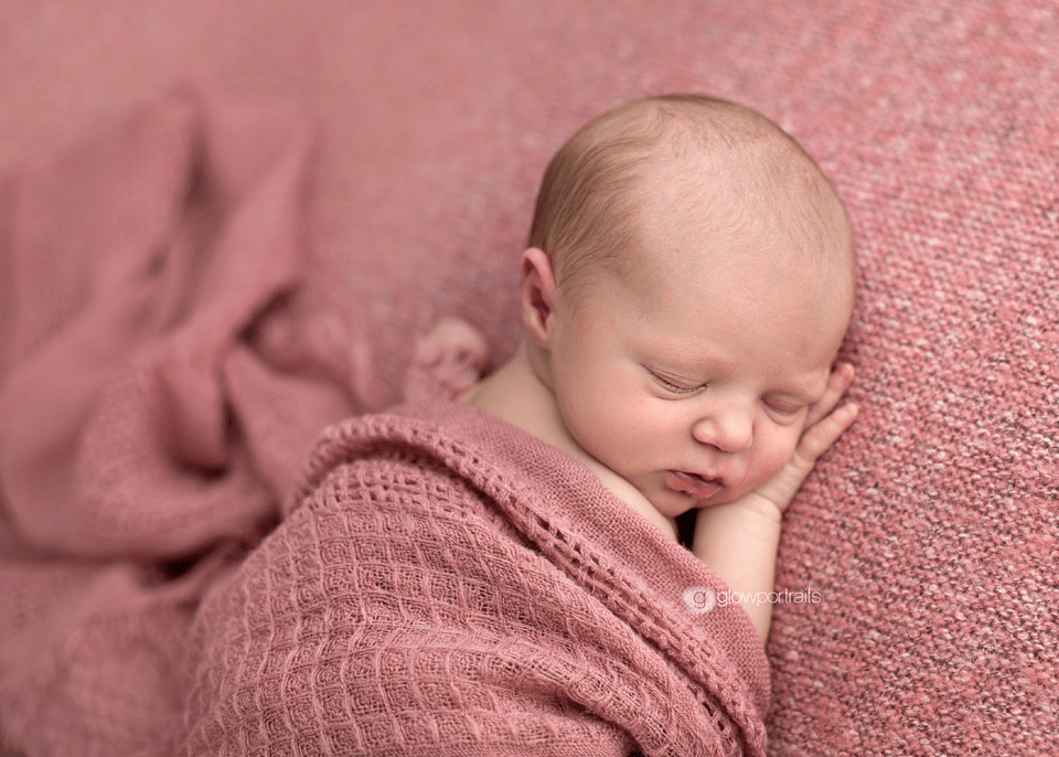 snuggled baby girl in pink