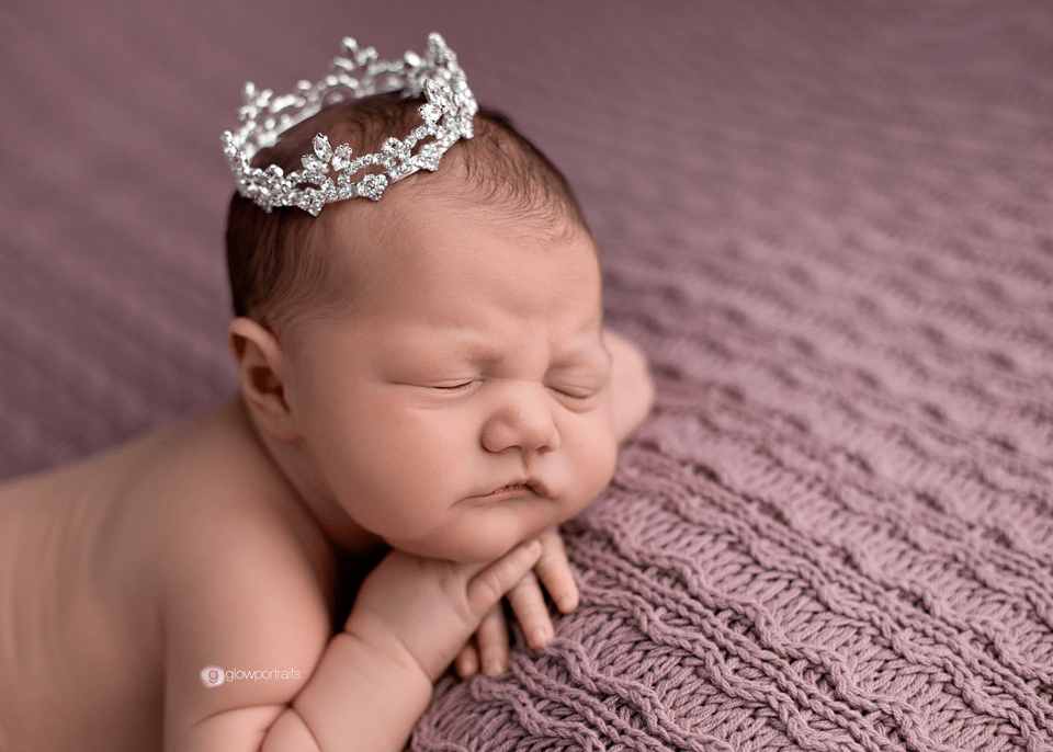 newborn with crown on